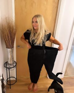 Showing weight loss with a pair of jeans in size when at biggest weight.